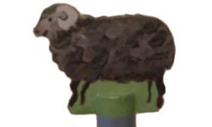 Toppen på hushållspappershållaren med ett får